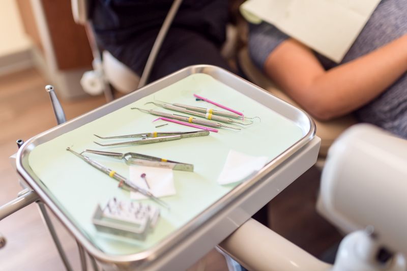 Tray with dental tools on it.