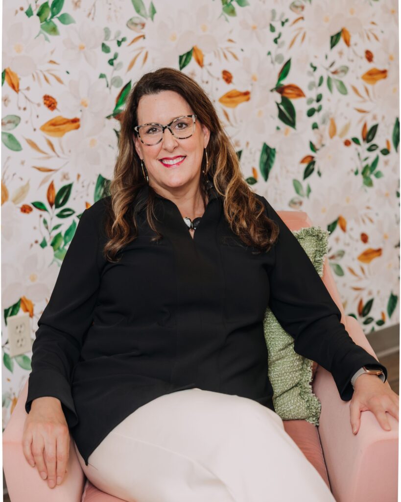 Dr. Larrimore seated and smiling at Larrimore Dental.