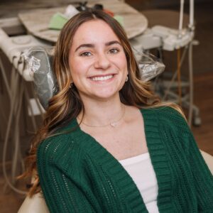 Confident patient smiling in dental chair at Larrimore Family Dentistry