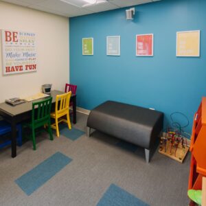Colorful kids play area in a dental waiting room with toys and seating