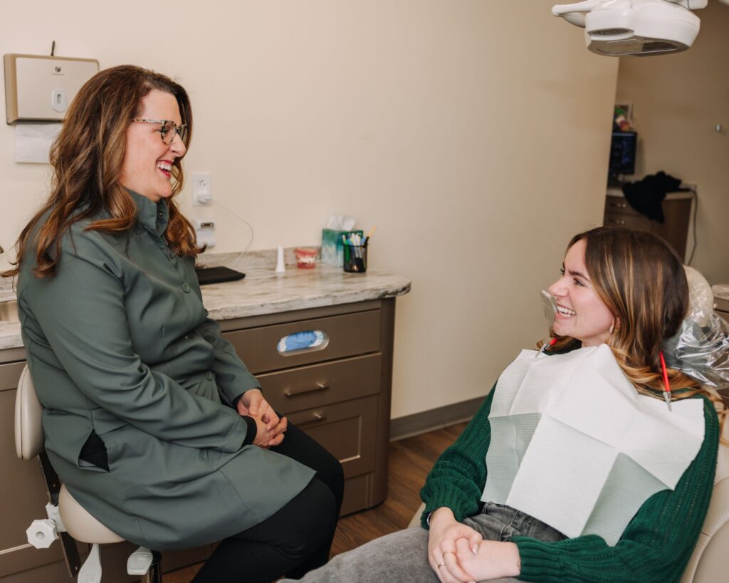 Dental professional having a comfortable consultation with a patient in the treatment room